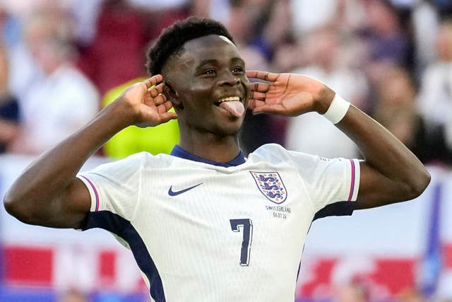 England’s Bukayo Saka celebrated scoring his penalty in the shoot-out win over Switzerland (Darko Vojinovic/AP)