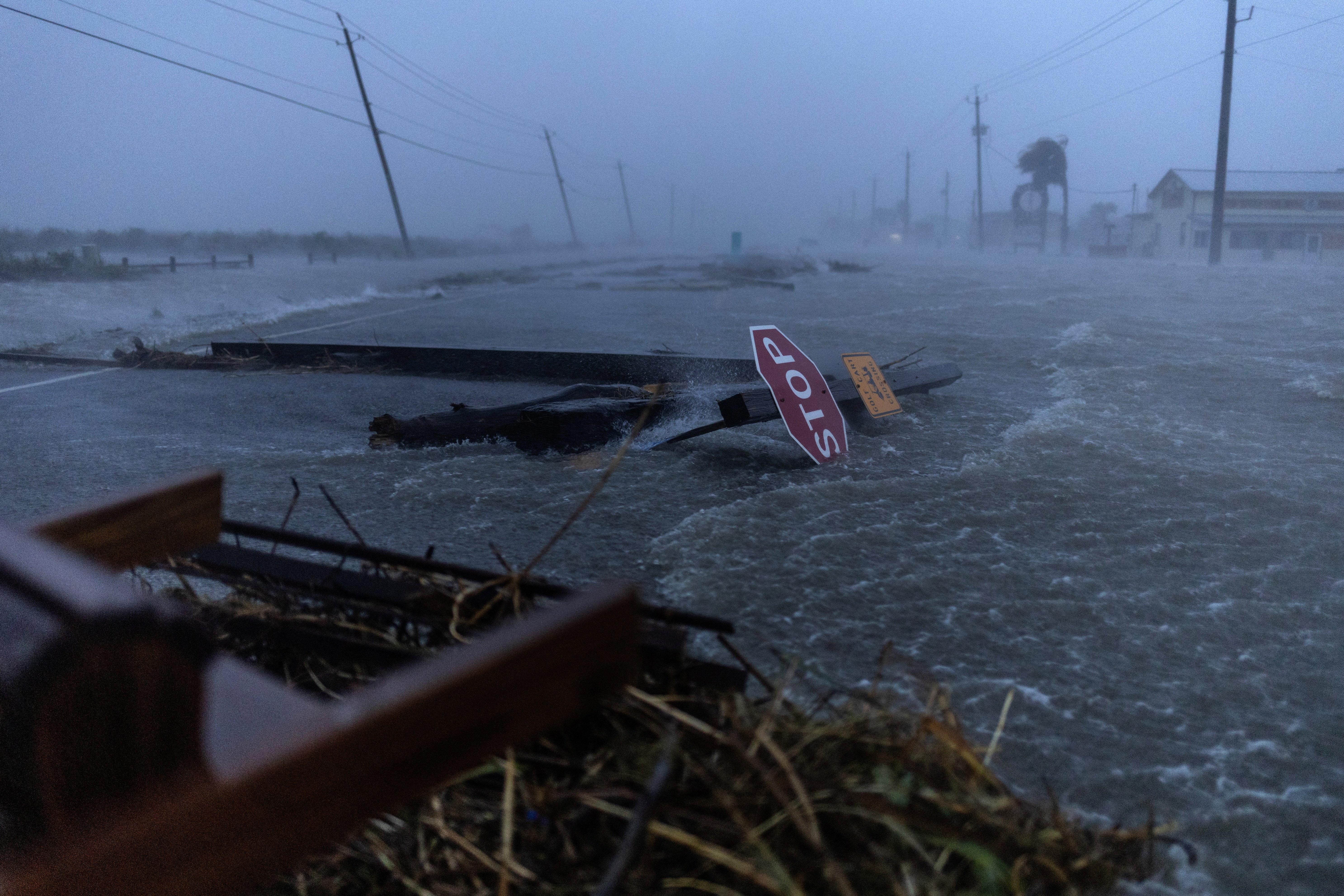 Debris and flood waters from Hurricane Beryl cover the main roadway in Surfside Beach, Texas, U.S., July 8, 2024