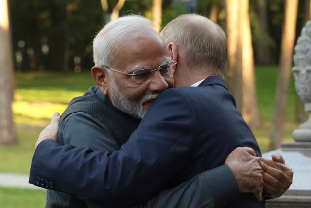 <p>Indian prime minister Narendra Modi, left, and Russian president Vladimir Putin embrace during an informal meeting at Novo-Ogaryovo, outside Moscow</p>