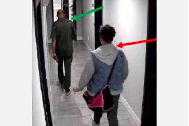 <p>Murder suspect Audrey Miller walking behind the victim, Fasil Teklemariam, toward the elevator in his building on the day he was killed </p>