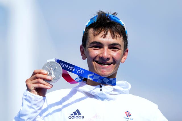 Alex Yee holds his Olympic silver medal in Tokyo (Martin Rickett/PA)