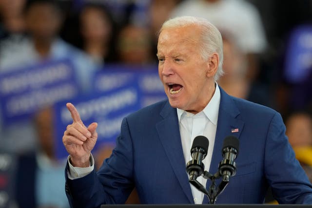 <p>President Joe Biden gestures during his remarks at Renaissance High School during a Friday, July 12, 2024, campaign event in Detroit</p>