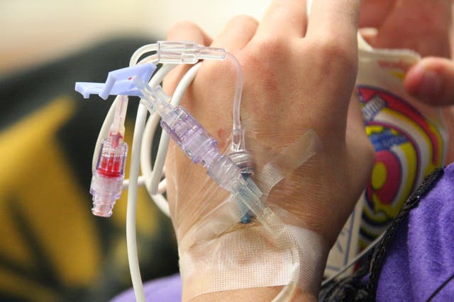 A young girl receiving chemotherapy. There is a 5% mortality rate resulting from conventional treatment, with toxically high doses of drugs