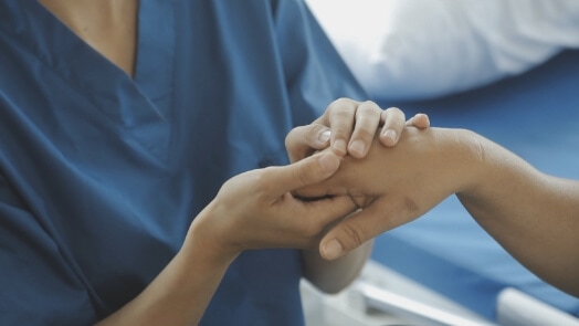 Medical personnel caring for a patient