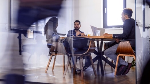 IT professionals in a conference room.