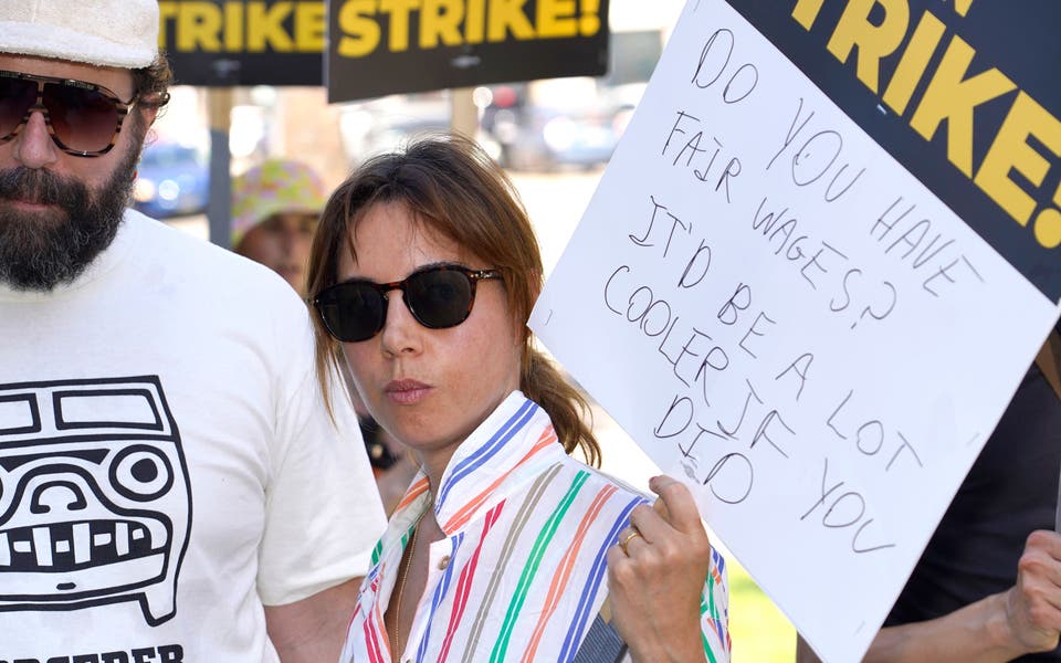 Cast of Parks And Recreation reunite on US picket line with four legged friend