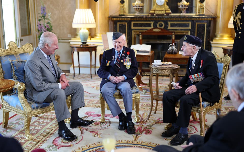 King and Queen hear moving recollections from D-Day veterans at Palace