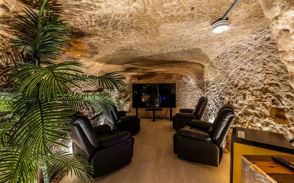 Flat with 'private cave cinema room' for sale for £300,000