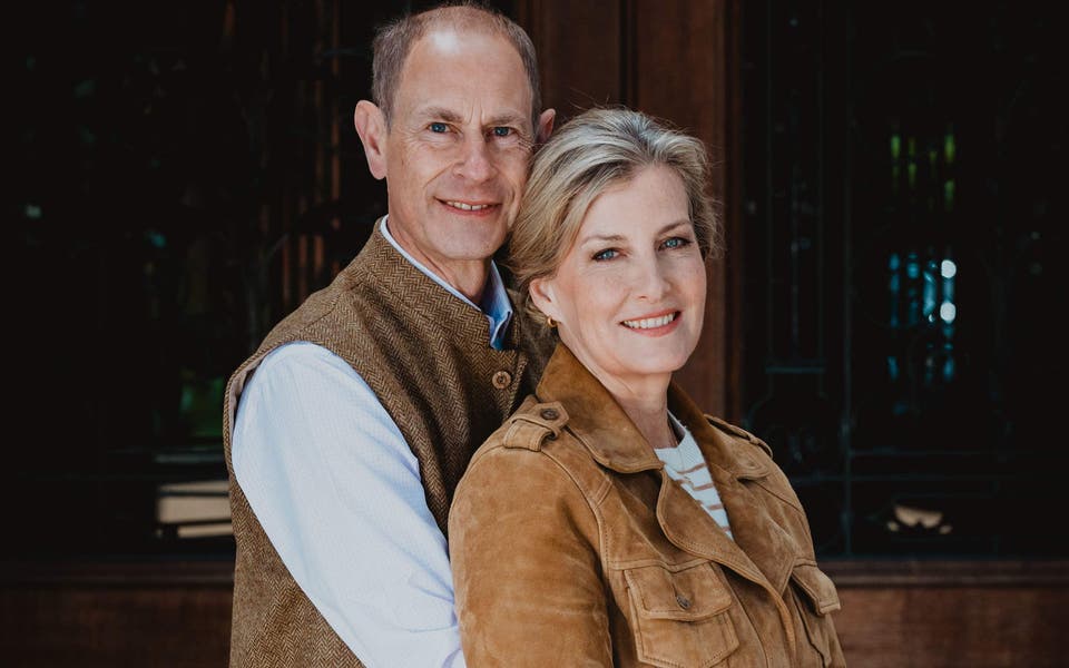 Edward and Sophie embrace in silver wedding anniversary portrait