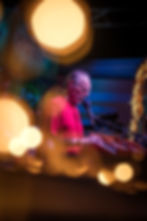 Creative photo of Krishna Das playing music