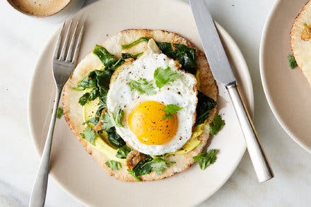 Indian-Spiced Eggs With Spinach and Turmeric Yogurt