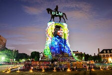 A photograph of Breonna Taylor, projected onto the statue of Robert E. Lee on Monument Avenue in Richmond, Va., July 2020.