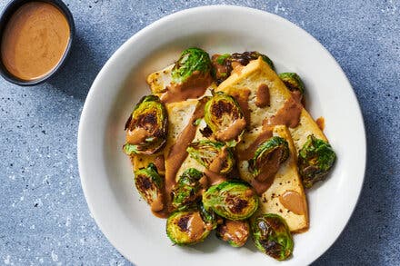 Sheet-Pan Tofu and Brussels Sprouts With Hoisin-Tahini Sauce