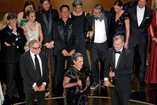 Emma Thomas, center, one of the producers of “Oppenheimer,” speaking after the film won the Oscar for best picture on Sunday.