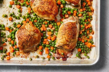 Sheet-Pan Herby Roast Chicken With Peas and Carrots