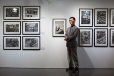 Na Kyung Taek with his photographs at an exhibition about the 1980 Gwangju Democratization Movement, in Gwangju, South Korea, this month.