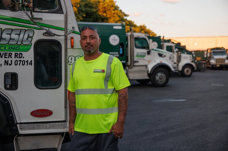 Angelo Cruz used an extinguisher from his recycling truck to put out a fire outside of a Manhattan cafe.