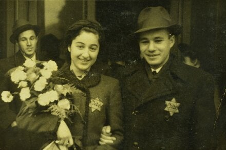 A photo of a young bride and groom, each wearing a Star of David, was among several featured in the “Weddings During the Holocaust” exhibit. 