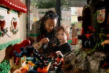 Kaitlin Becker with her son, Everett, at a vintage toy museum in Queens. “I’m a sucker for nostalgia,” Ms. Becker said.