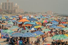 The heat of a July weekend filled the beach at Coney Island in Brooklyn on Saturday.