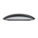 Side of Magic Mouse showing black surface and aluminium base.