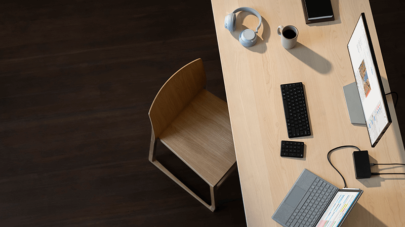 Surface Pro, Surface Headphones, mouse and keyboard on a desk