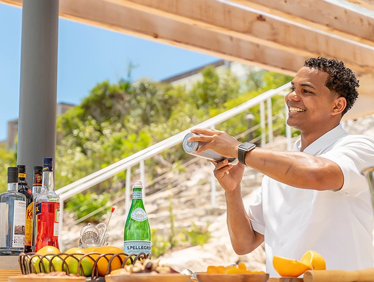 a man shaking up a drink