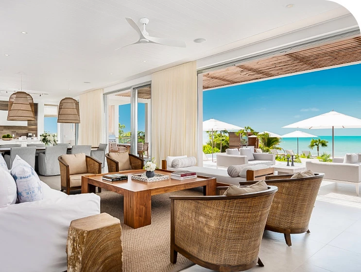 a living room with a large pool table and chairs