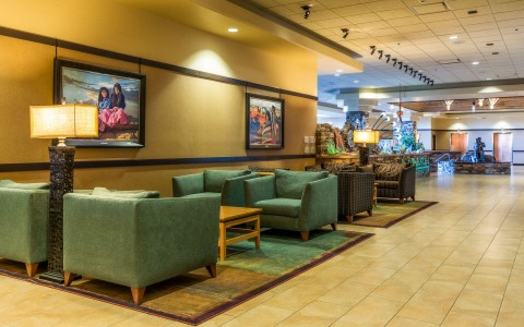 hotel lobby with green couches 