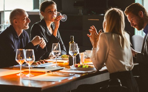 friends having dinner and wine