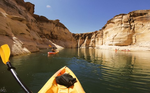 person kayaking in a canyon