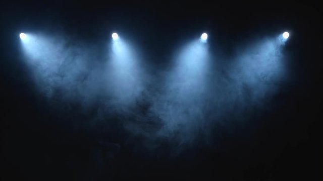 Flow stage of formless smoke swirling against a black background