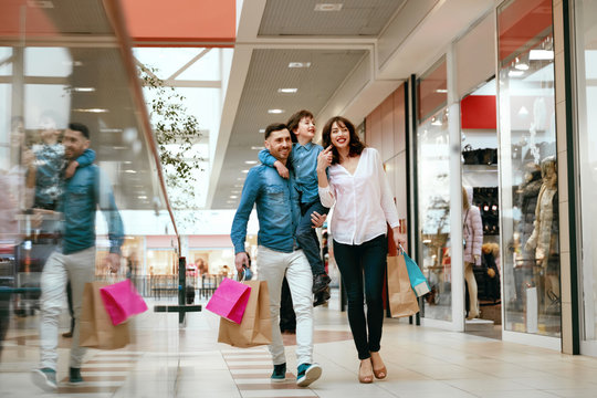 Family Shopping. Happy People In Mall