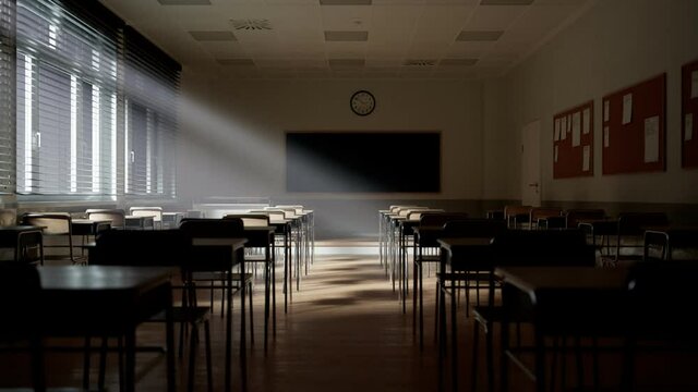 Rays of light falling to the empty classroom. Abandoned school. Disturbing mood