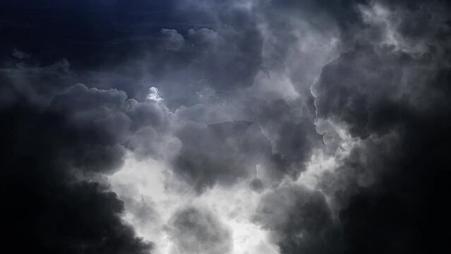 Epic thunderstorm moving clouds at night with lightning seamless loop.