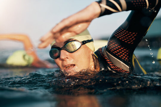 Mature woman and her class swimming in the open ocean