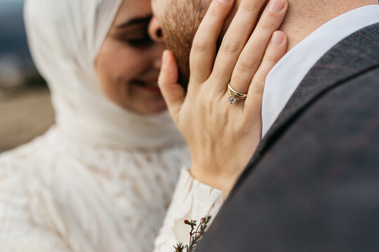 Bride and groom hugging in the mountains 