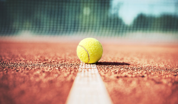 Tennis ball on the tennis court. Sport, recreation concept