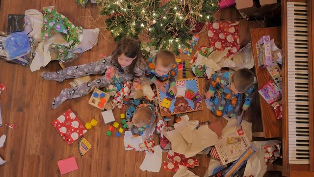 Children Overhead playing with toys christmas day.