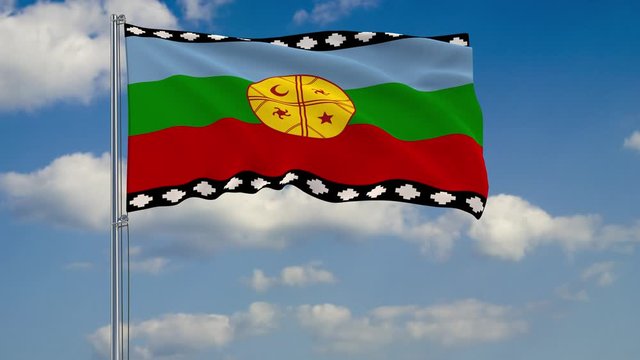 Flag of Mapuche against background of clouds floating on the blue sky.