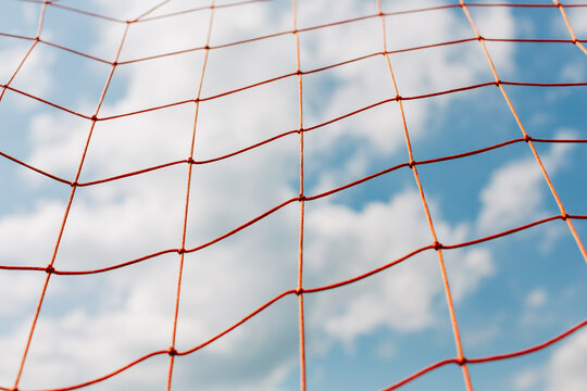 Orange net on the sky background 