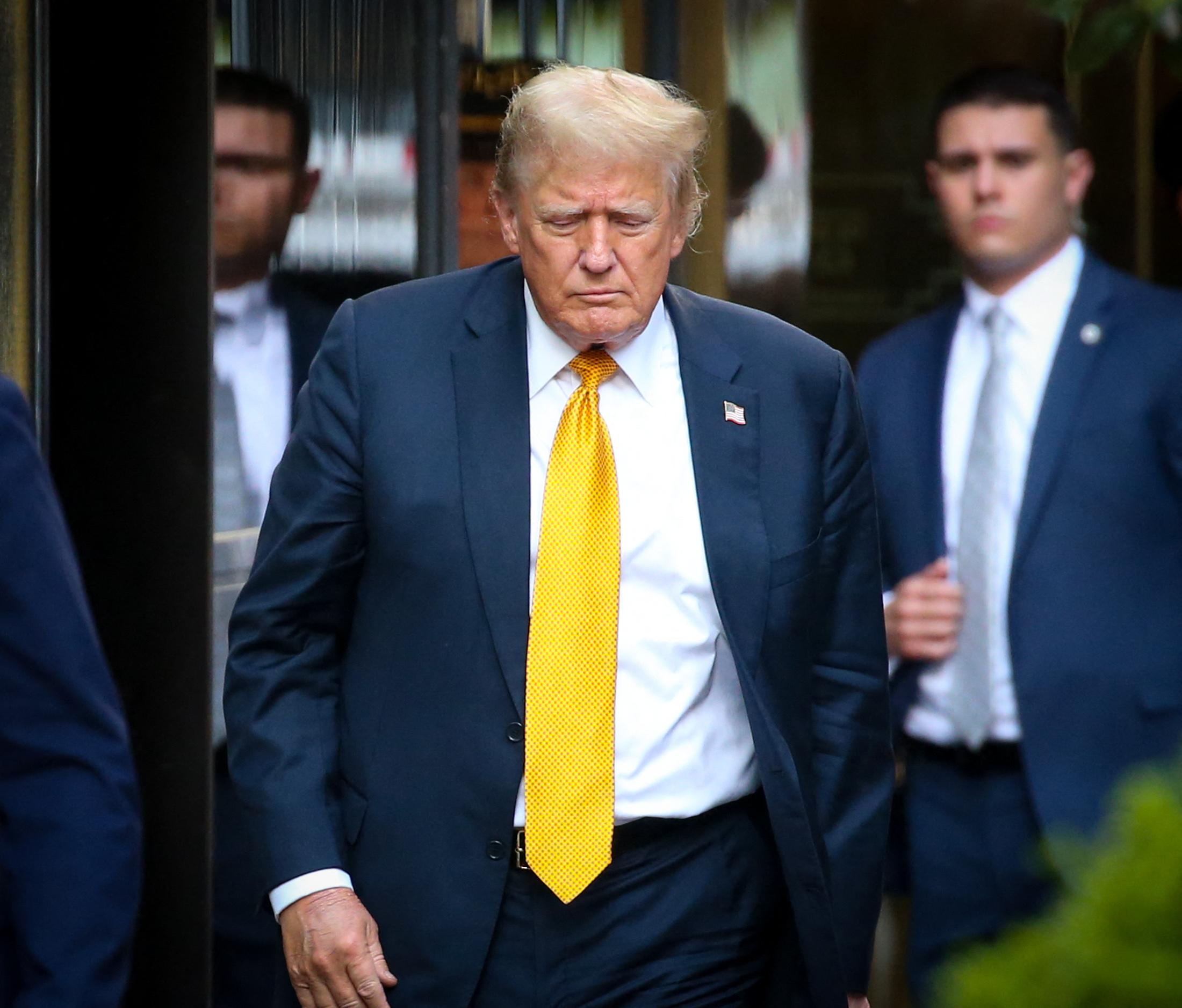 Donald Trump comes right up to the barriers at Trump Tower to wave to all the crowds