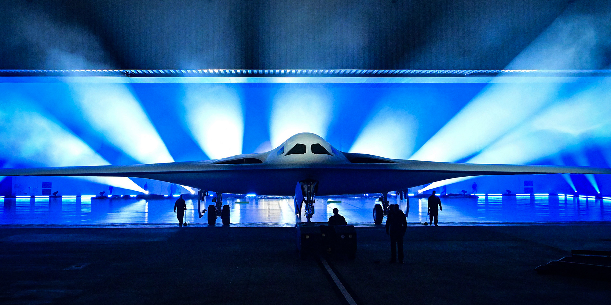 The B-21 Raider is unveiled during a ceremony at Northrop Grumman's Air Force Plant 42 in Palmdale, California, December 2, 2022. - The high-tech stealth bomber can carry nuclear and conventional weapons and is designed to be able to fly without a crew on board. The B-21 -- which is on track to cost nearly $700 million per plane and is the first new US bomber in decades -- will gradually replace the B-1 and B-2 aircraft, which first flew during the Cold War. (Photo by Frederic J. BROWN / AFP) (Photo by FREDERIC J. BROWN/AFP via Getty Images)