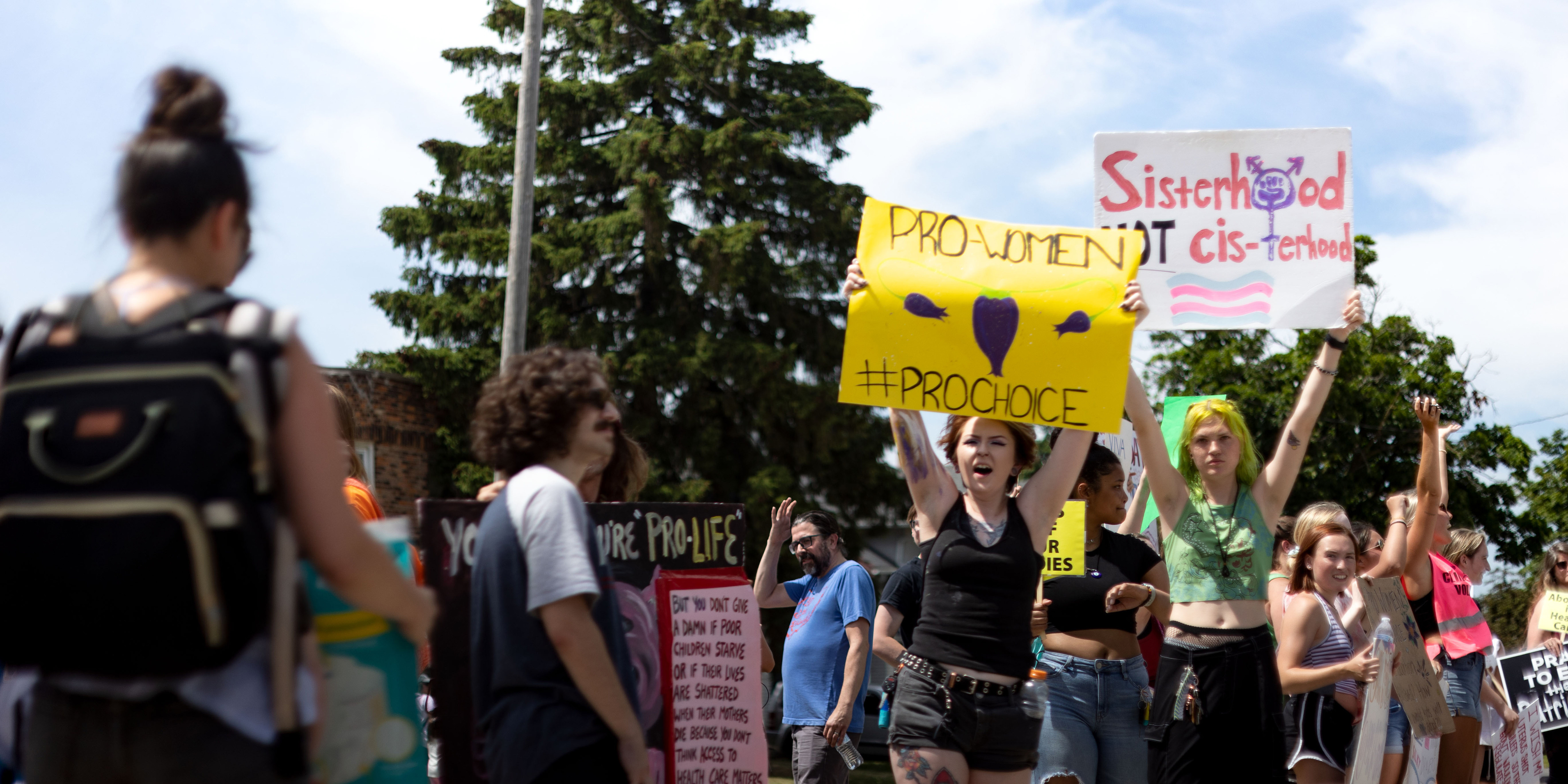 TOLEDO, OHIO, UNITED STATES - 2022/06/25: Counter protesters hold placards in favor of abortion and against an anti-abortion prayer circle. Protesters came to disrupt a prayer rally praying to end abortion. (Photo by Stephen Zenner/SOPA Images/LightRocket via Getty Images)