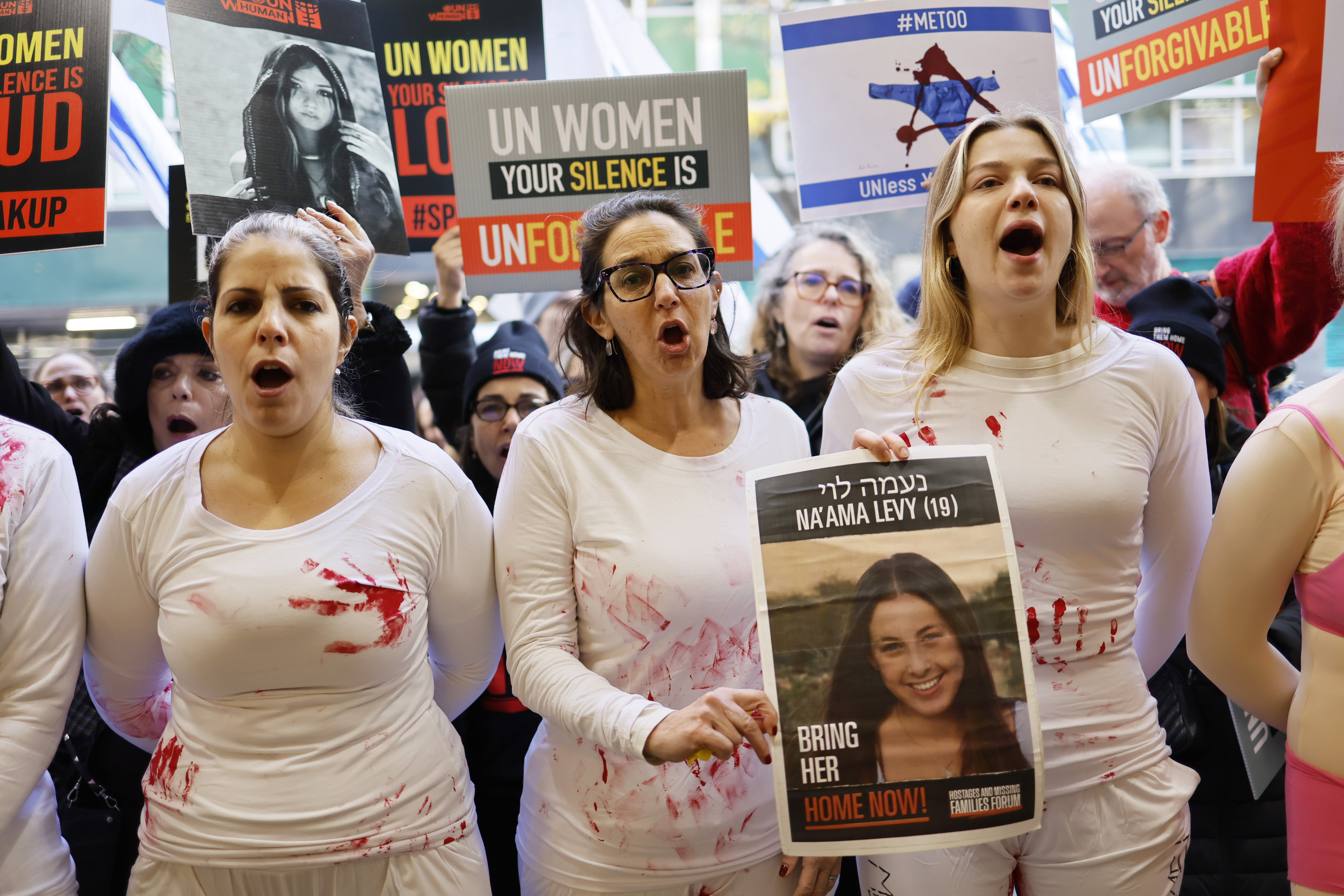 NEW YORK, NEW YORK - NOVEMBER 27: Protestors gather at the offices of the United Nations Women on November 27, 2023 in New York City. The group Bring Them Home Now held a protest to observe International Day for the Elimination of Violence against Women to bring attention to the Israeli women who were allegedly raped during the terror attack by the militant group Hamas on October 7th. (Photo by Michael M. Santiago/Getty Images)