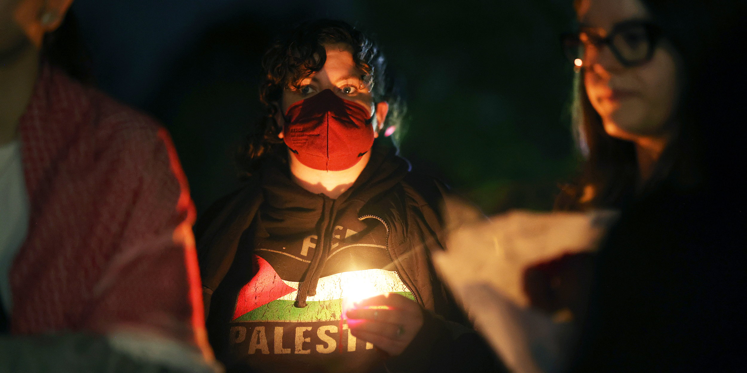 PLAINFIELD, ILLINOIS - OCTOBER 17: An overflow crowd listens from outside as community members filled the Prairie Activity and Rec Center for a vigil for 6-year-old Palestinian-American Wadea Al-Fayoume on October 17, 2023 in Plainfield, Illinois. Al-Fayoume was stabbed to death Saturday by his landlord. His mother, Hanaan Shahin, also suffered more than a dozen stab wounds in the attack and remains hospitalized. Police have said that the family was attacked because of their Muslim faith. More than a thousand people attended the vigil.  (Photo by Scott Olson/Getty Images)