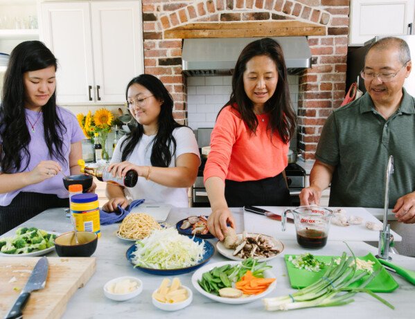 Sarah, Kaitlin, Judy, and Bill cooking together