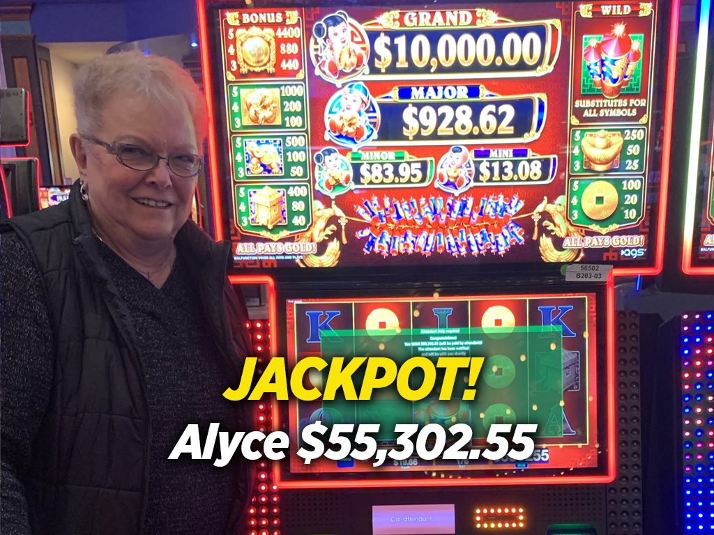 A man standing in front of a slot machine.