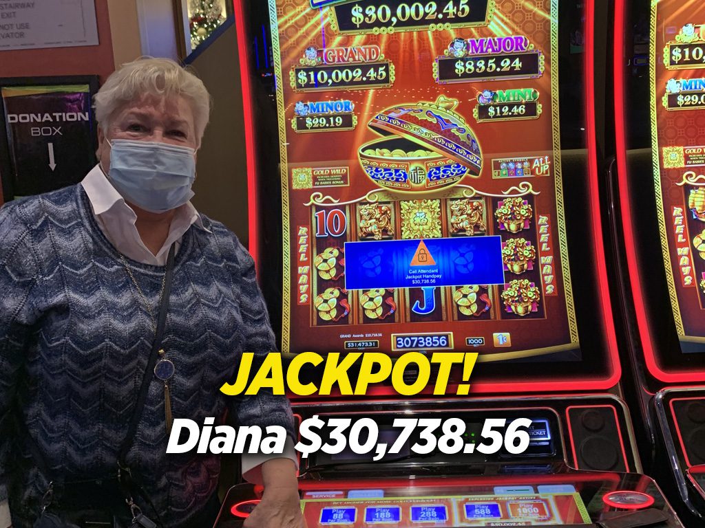 A woman in front of a slot machine with the word jackpot.