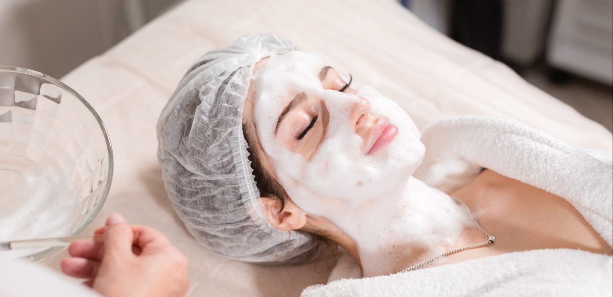 A woman with a face mask on laying down